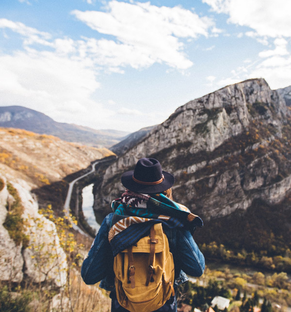 woman hiking on mountain trail